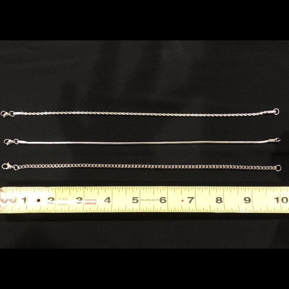 Set of 3 stainless steel ankle bracelets.